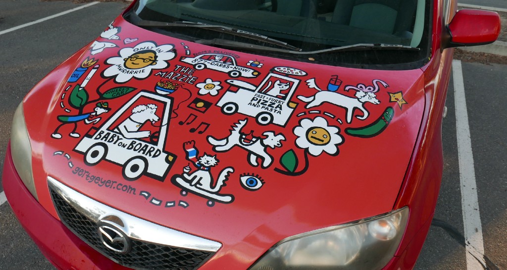 The Mazzie — bonnet artwork on a red Mazda 2